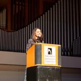 Carol Spahn, director of the US Peace Corps, gives remarks at podium.